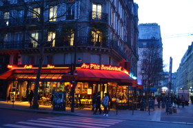 Cafe in Paris in evening lights